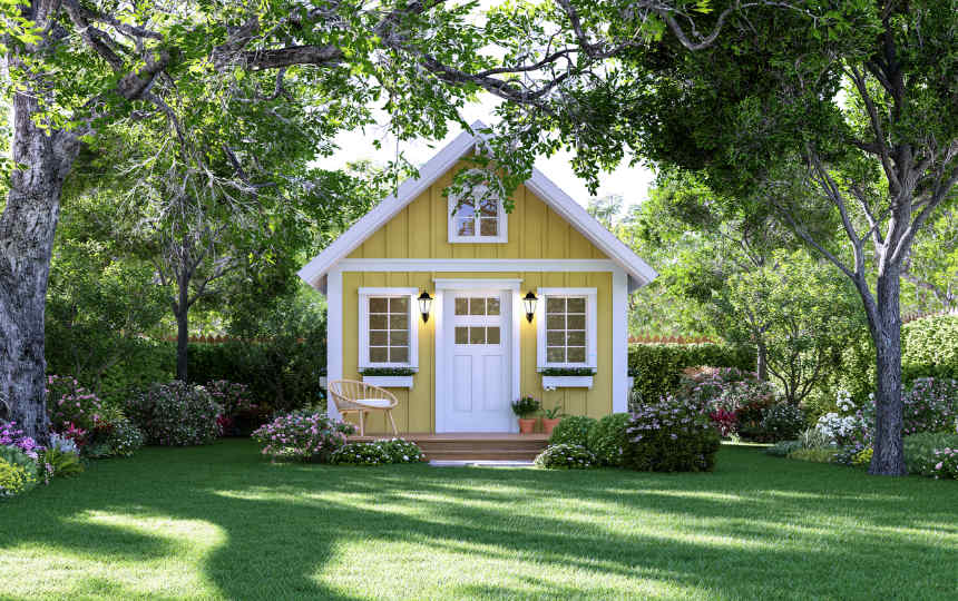 small backyard cottage with window boxes, nice lawn and landscaping